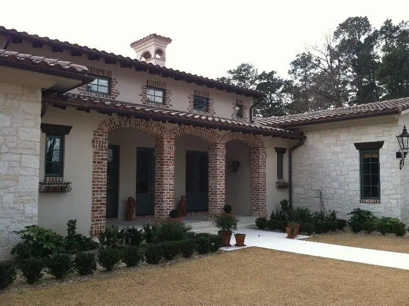 Brick arches and limestone walls on a Mediterranean-style home